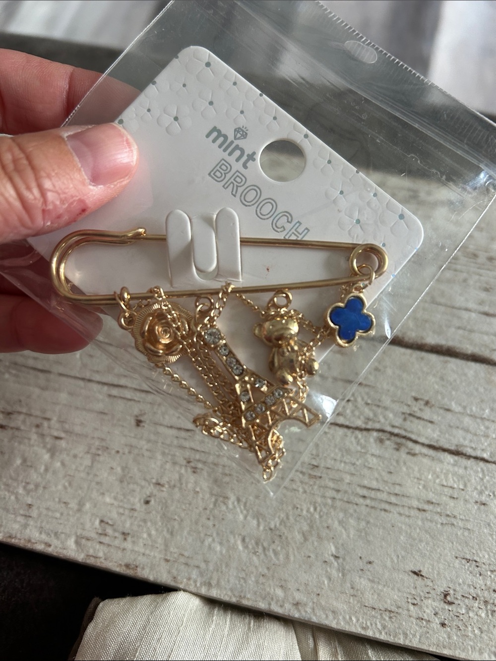 5/$25 gold brooch with teddy bear and Paris charm